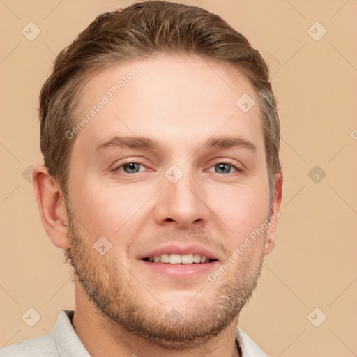 Joyful white young-adult male with short  brown hair and grey eyes