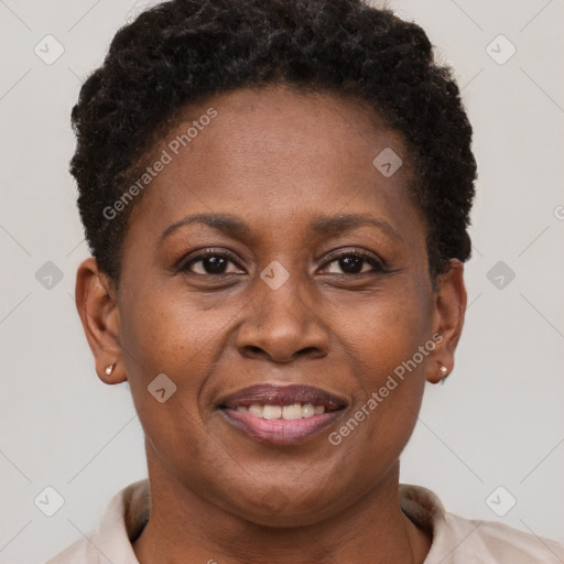 Joyful black adult female with short  brown hair and brown eyes