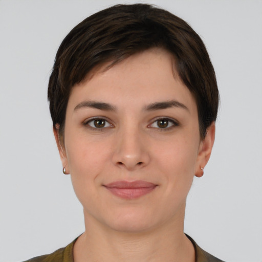 Joyful white young-adult female with short  brown hair and brown eyes