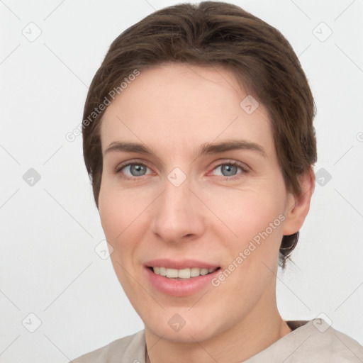 Joyful white young-adult female with short  brown hair and grey eyes