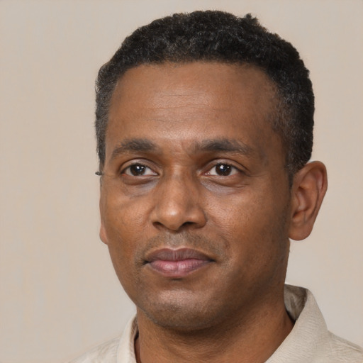 Neutral black adult male with short  black hair and brown eyes