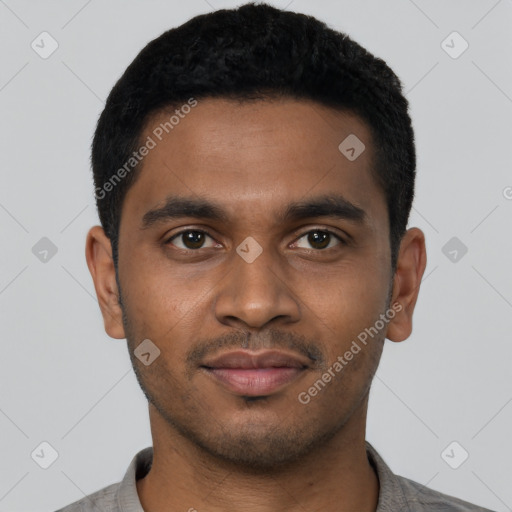 Joyful black young-adult male with short  black hair and brown eyes
