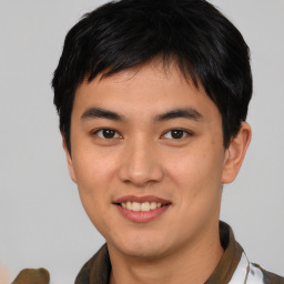 Joyful asian young-adult male with short  black hair and brown eyes