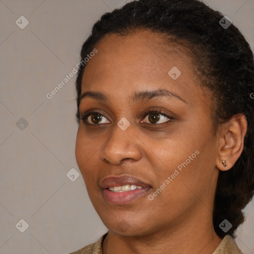 Joyful black young-adult female with medium  black hair and brown eyes