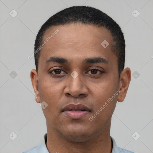 Neutral latino young-adult male with short  black hair and brown eyes