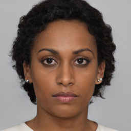 Neutral black young-adult female with short  brown hair and brown eyes