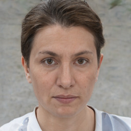 Joyful white adult female with short  brown hair and brown eyes