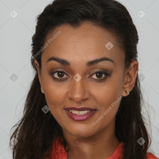Joyful black young-adult female with long  brown hair and brown eyes