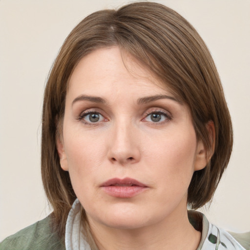 Neutral white young-adult female with medium  brown hair and grey eyes