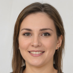 Joyful white young-adult female with long  brown hair and grey eyes