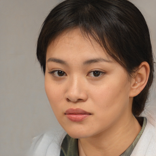 Neutral asian young-adult female with medium  brown hair and brown eyes