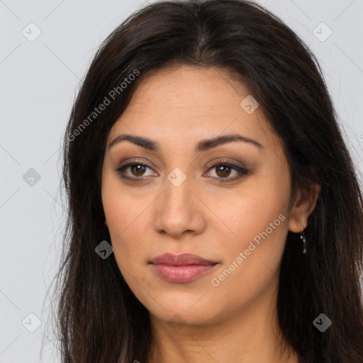 Joyful latino young-adult female with long  brown hair and brown eyes