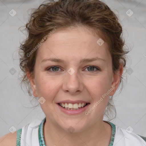 Joyful white young-adult female with medium  brown hair and blue eyes