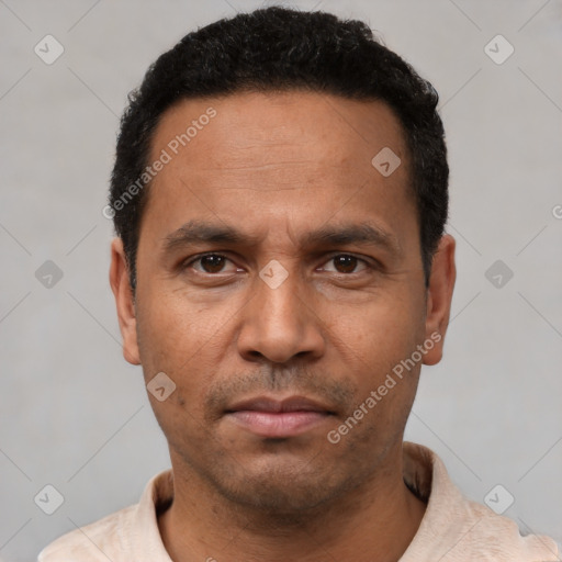 Neutral latino adult male with short  black hair and brown eyes