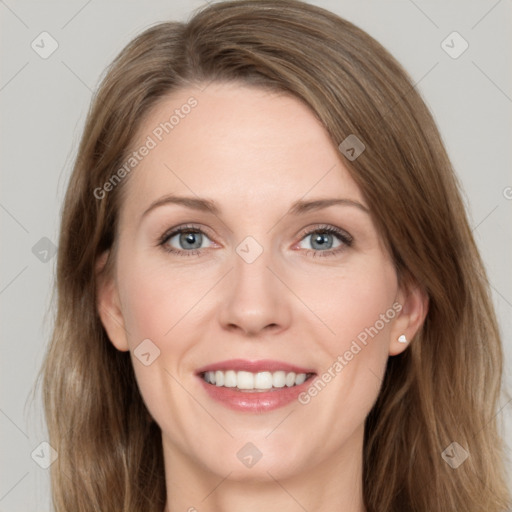 Joyful white young-adult female with long  brown hair and green eyes