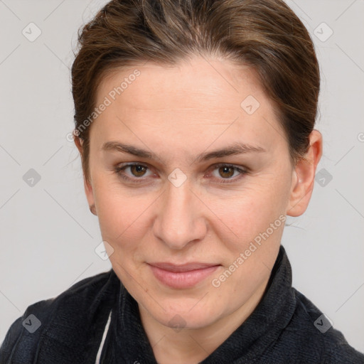 Joyful white adult female with medium  brown hair and grey eyes