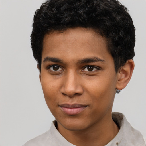 Joyful latino young-adult male with short  brown hair and brown eyes