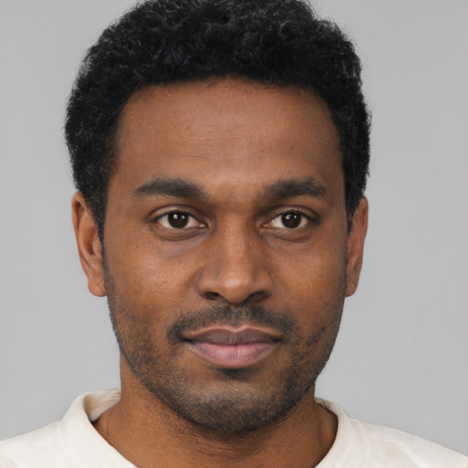 Neutral black young-adult male with short  brown hair and brown eyes