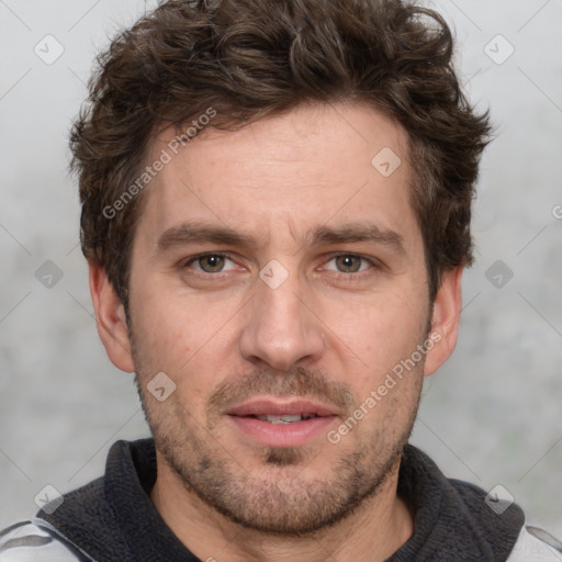 Joyful white adult male with short  brown hair and grey eyes