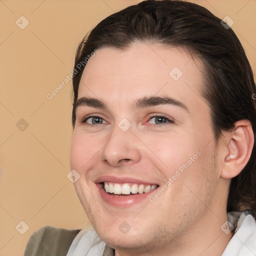 Joyful white young-adult male with medium  brown hair and brown eyes