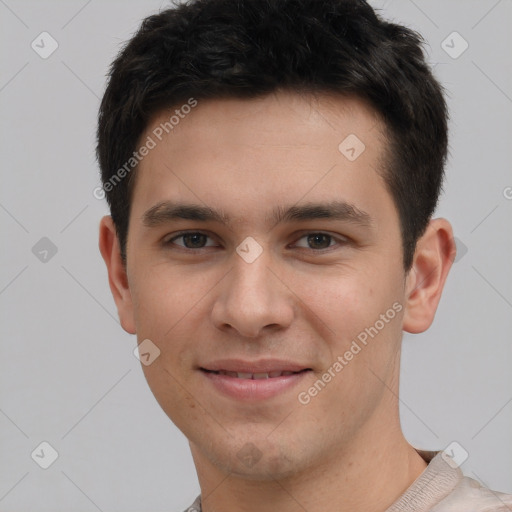 Joyful white young-adult male with short  brown hair and brown eyes