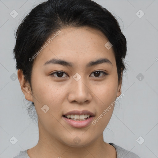 Joyful asian young-adult female with short  black hair and brown eyes