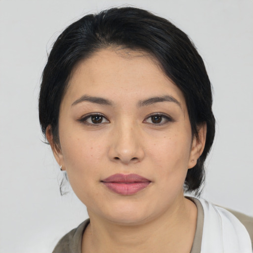 Joyful asian young-adult female with medium  black hair and brown eyes