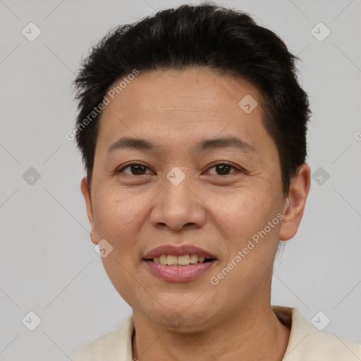 Joyful asian adult male with short  brown hair and brown eyes