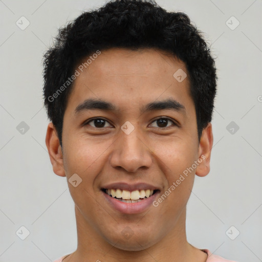 Joyful latino young-adult male with short  black hair and brown eyes