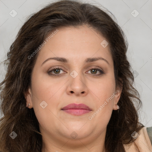 Joyful white adult female with long  brown hair and brown eyes