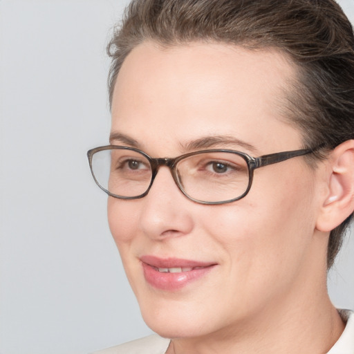 Joyful white adult female with short  brown hair and brown eyes