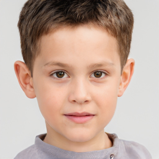 Joyful white child male with short  brown hair and brown eyes