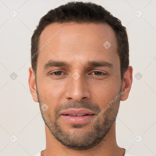 Joyful white young-adult male with short  brown hair and brown eyes