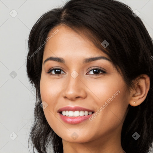 Joyful latino young-adult female with long  brown hair and brown eyes