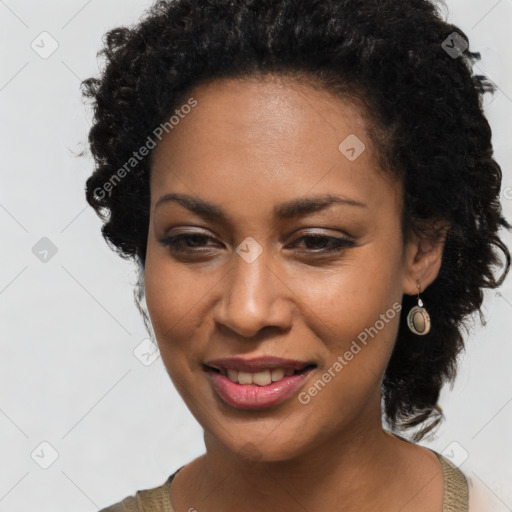 Joyful black young-adult female with medium  brown hair and brown eyes