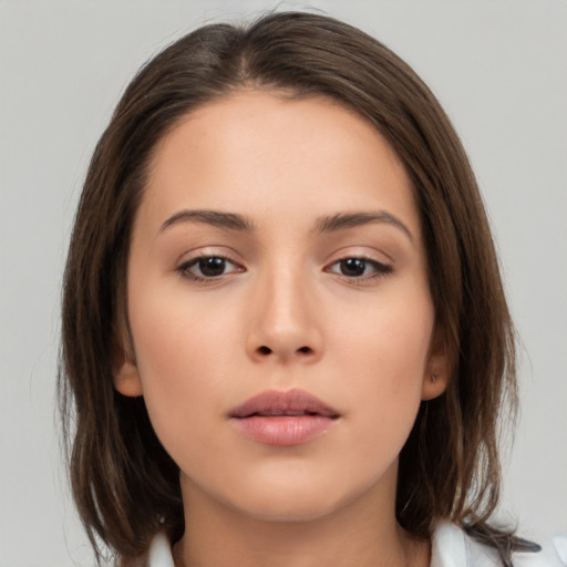 Neutral white young-adult female with medium  brown hair and brown eyes