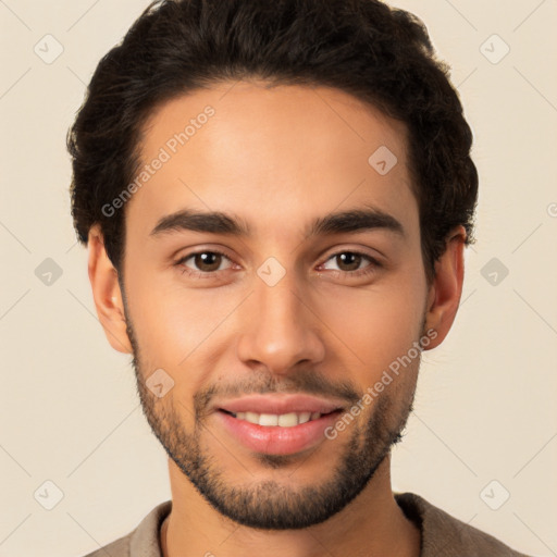 Joyful latino young-adult male with short  brown hair and brown eyes