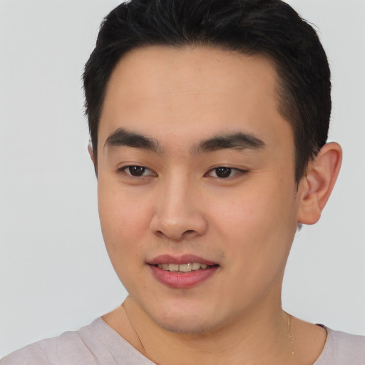 Joyful asian young-adult male with short  black hair and brown eyes