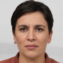 Joyful white adult female with short  brown hair and brown eyes