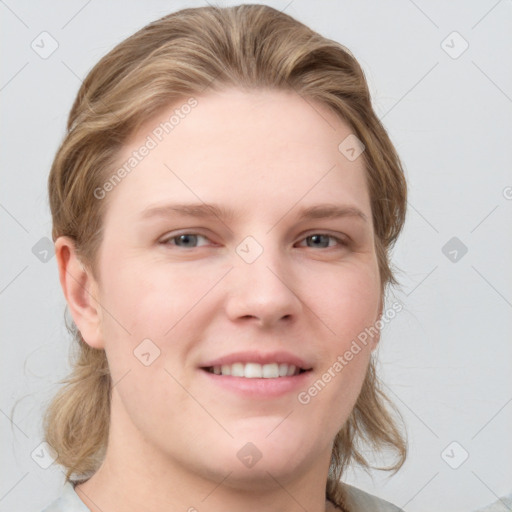 Joyful white young-adult female with medium  brown hair and blue eyes