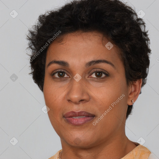 Joyful black adult female with short  brown hair and brown eyes