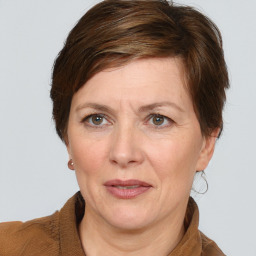 Joyful white adult female with medium  brown hair and grey eyes