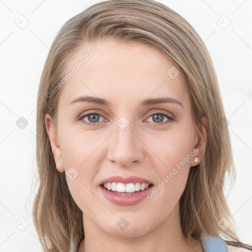 Joyful white young-adult female with medium  brown hair and blue eyes