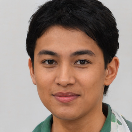 Joyful asian young-adult female with short  black hair and brown eyes