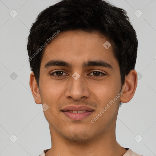 Joyful latino young-adult male with short  brown hair and brown eyes