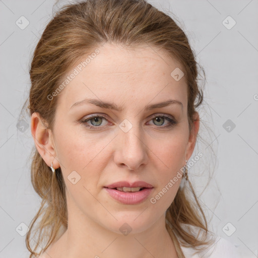 Joyful white young-adult female with medium  brown hair and blue eyes