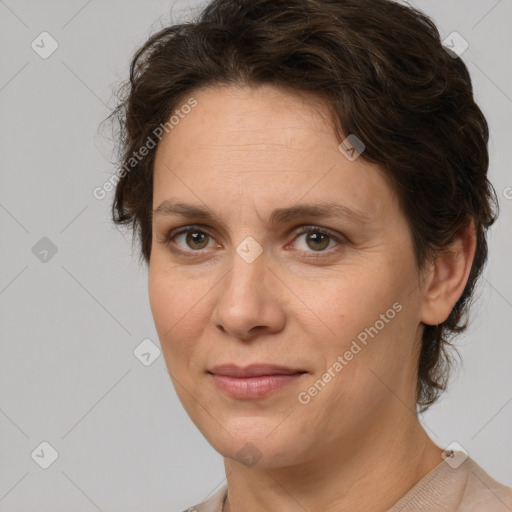 Joyful white adult female with short  brown hair and brown eyes