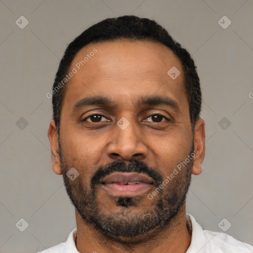 Neutral latino adult male with short  black hair and brown eyes