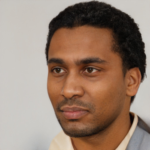 Neutral black young-adult male with short  black hair and brown eyes