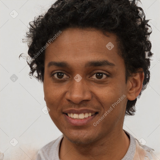 Joyful black young-adult male with short  brown hair and brown eyes